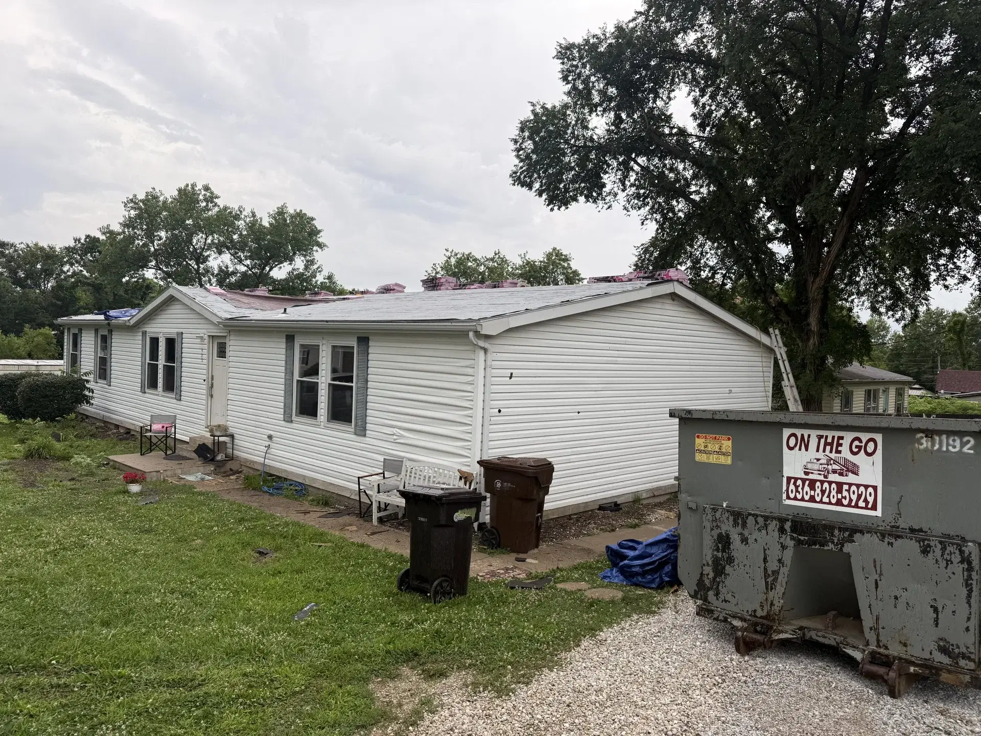 Home with light siding before an exterior update