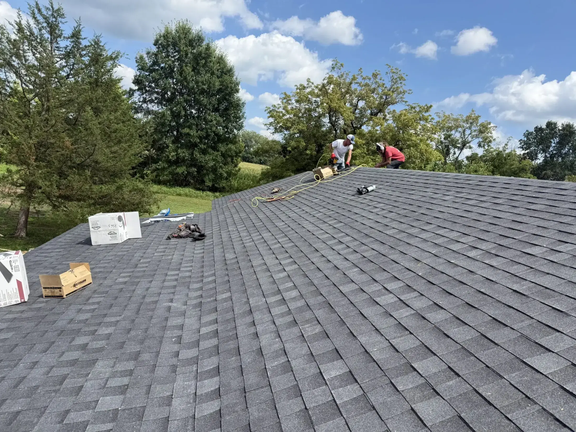The Robinson’s crew installing a new shingle roof on a Missouri home